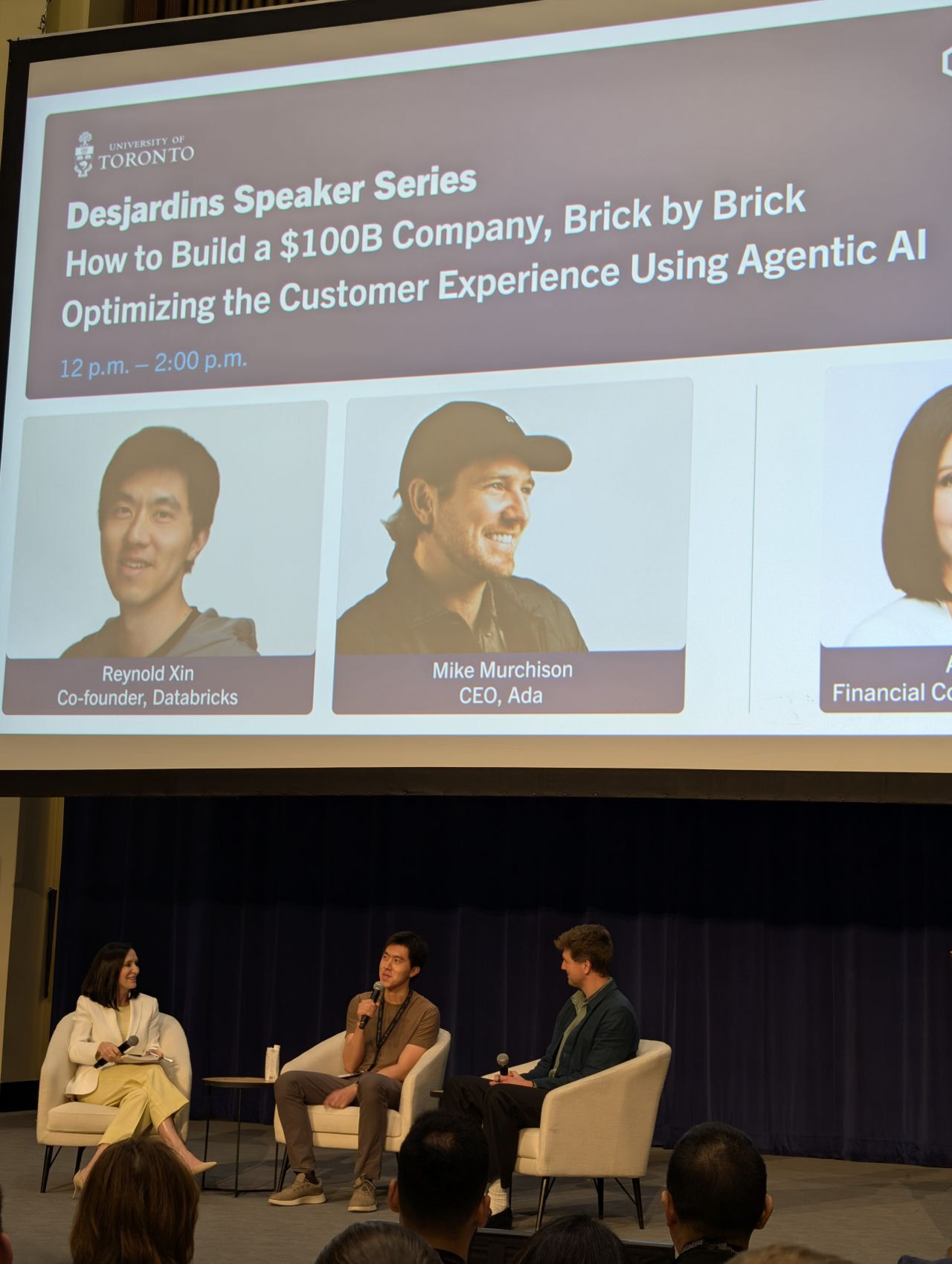 Panel at Toronto Tech Week with Reynold Xin of Databricks and Mike Murchison of ada CX on stage with a moderator